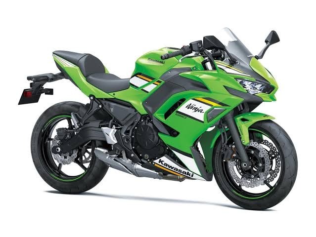 The new 2027 Kawasaki Ninja 500 sports bike parked on a mountain road showcasing its aerodynamic design